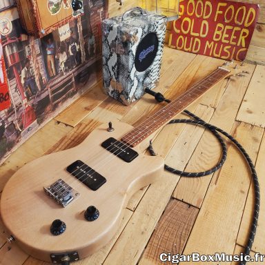 Guitare cigar box solid body électrique 4 cordes avec deux micro P90 et switch 3 positions.